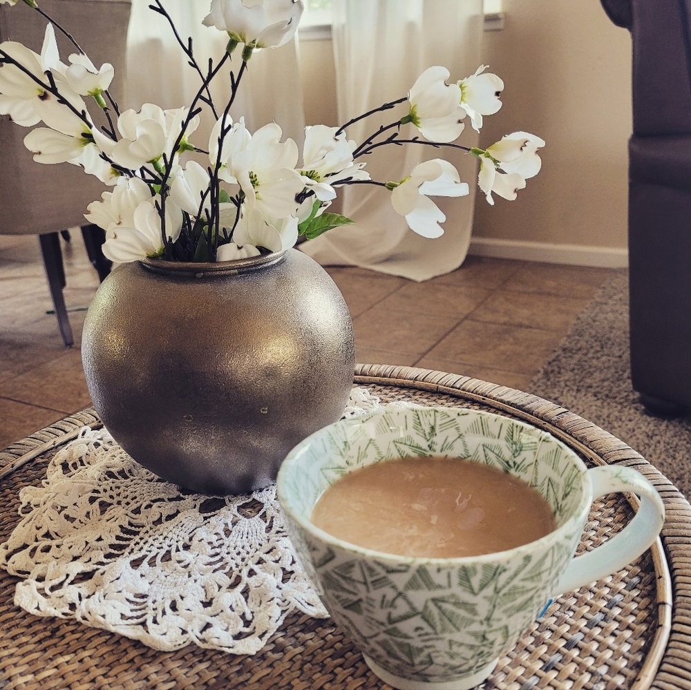 Round metal vase in a brassy vintage gold color.